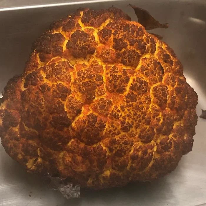 A Head Of Cauliflower That Was Cooked Resembles A Fireball Or Explosion Happening