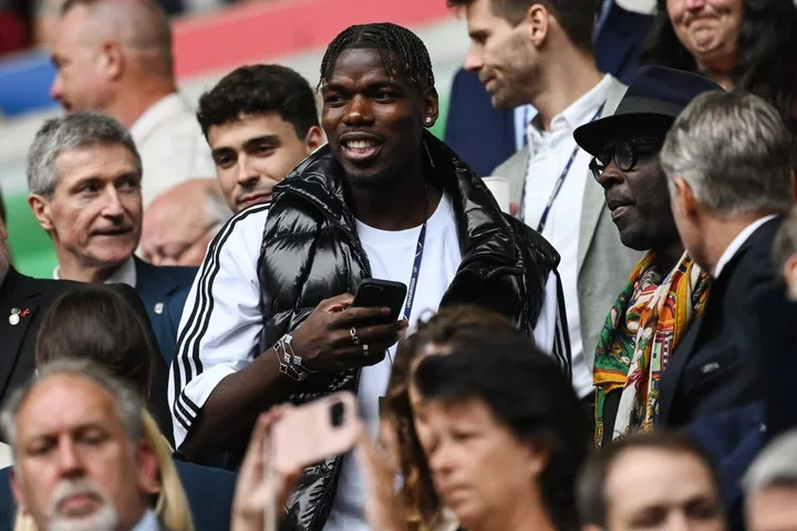 Paul Pogba and Lilian Thuram of France in the stand during the UEFA EURO 2024 round of 16 match between France and Belgium at Düsseldorf Arena on J...