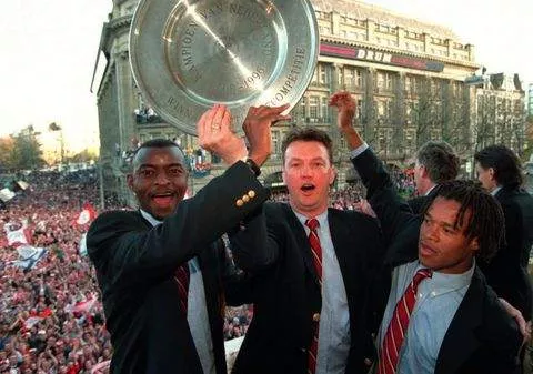 Finidi George celebrates winning the Eredivisie with Loius van Gaal and Edgar Davids