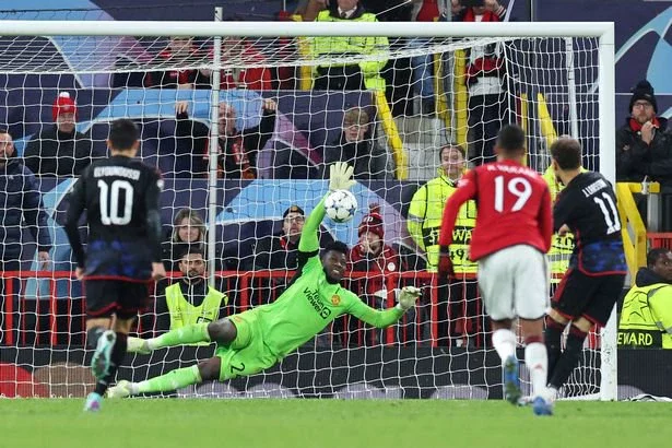 MANCHESTER, ENGLAND - OCTOBER 24: Andre Onana of Manchester United saves a penalty by Jordan Larsson of FC Copenhagen during the UEFA Champions League match between Manchester United and F.C. Copenhagen at Old Trafford on October 24, 2023 in Manchester, England. (Photo by Jan Kruger/Getty Images)