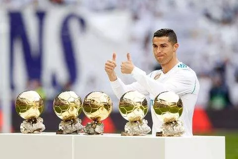 Cristiano Ronaldo with his five Ballon d'Ors - Imago