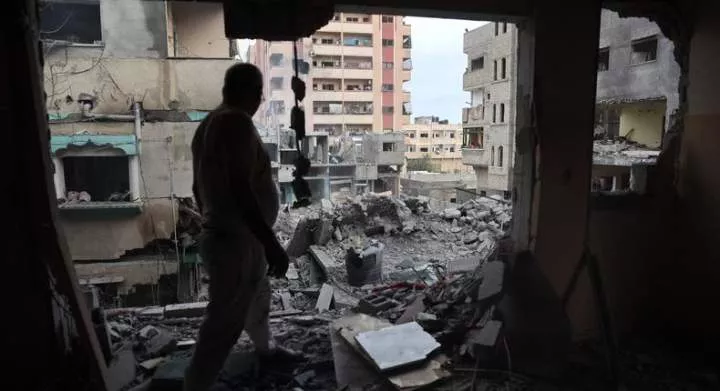 A Palestinian man inspects the damage a day after the Israeli operation in the Nuseirat camp in the central Gaza Strip on June 9, 2024.EYAD BABA/ Getty Images