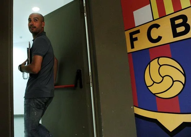 Barcelona's coach Josep Guardiola leaves after a press conference on May 24, 2012 at Camp Nou stadium in Barcelona on the eve of the 2012 King's Cup final football match between Athletic Bilbao and FC Barcelone