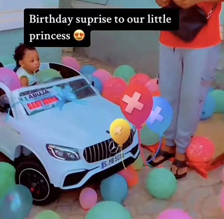 'Small pikin don first me buy car' - Reactions as parents surprise their baby girl with new car