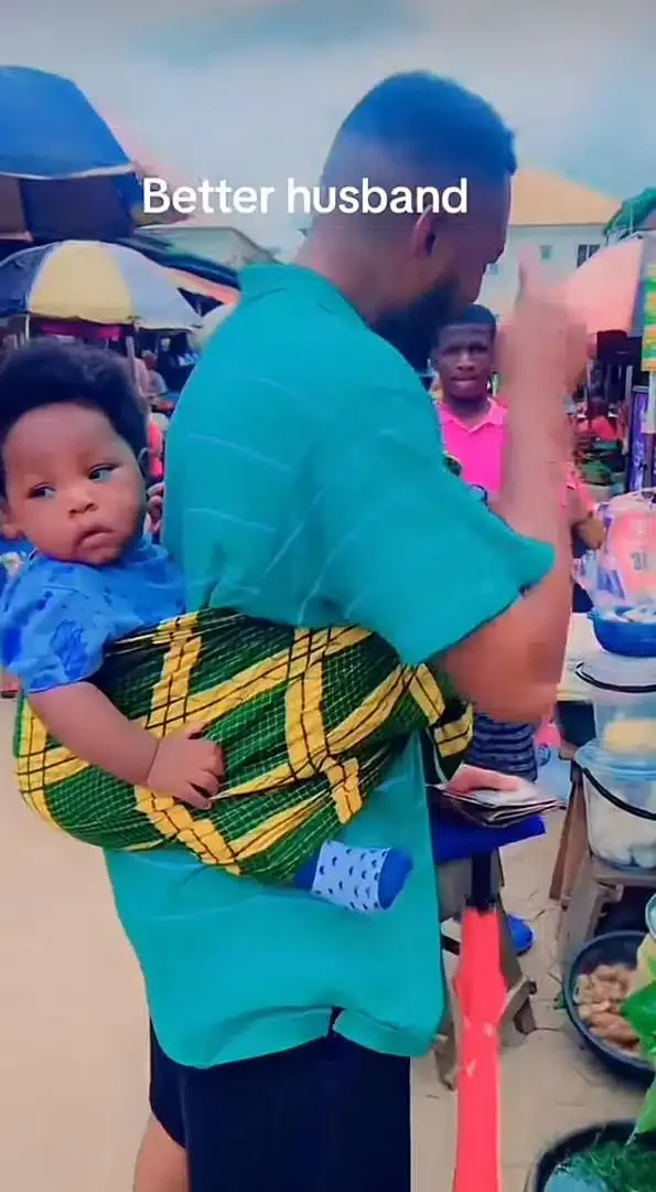 'If na yahoo boy, he go dey form' - Man praised as he storms market backing baby