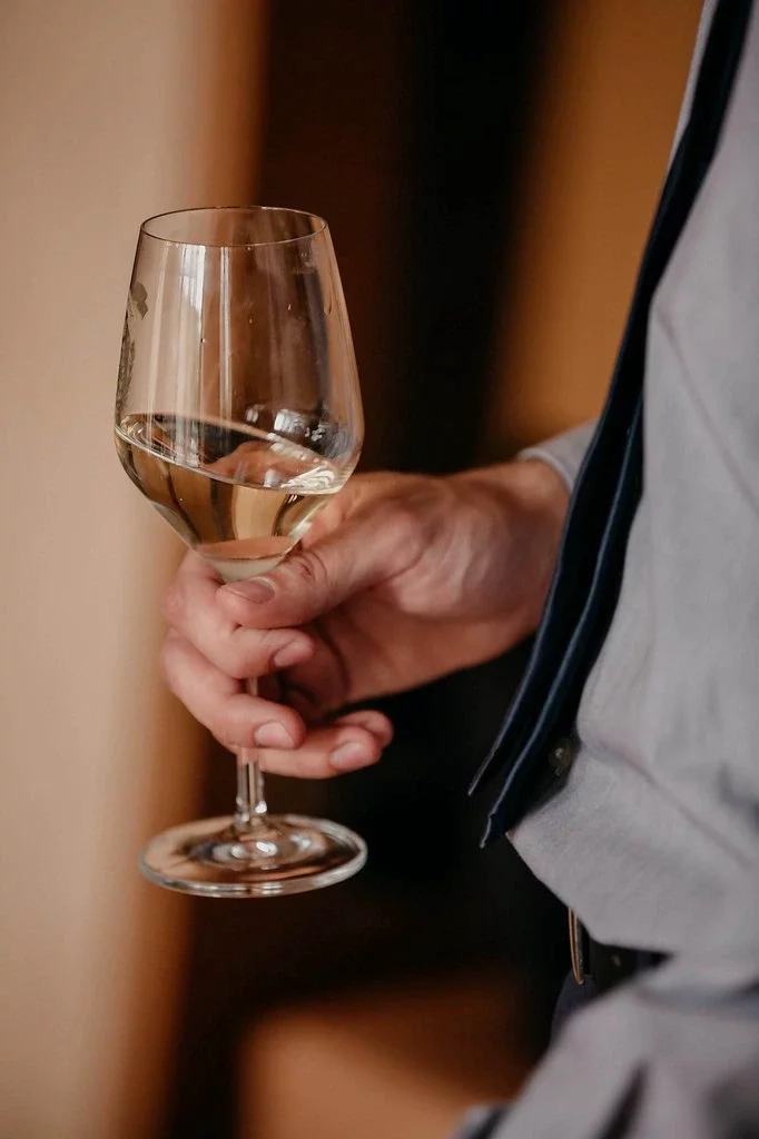 How to Hold a Wine Glass Properly & Why It Matters