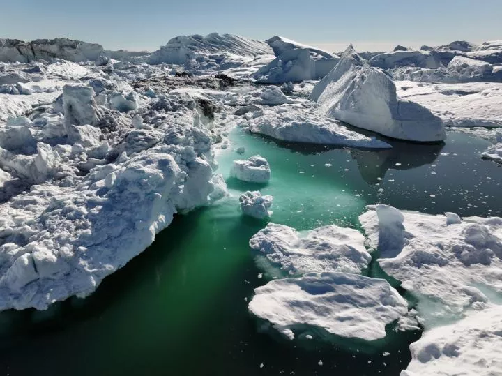 In this aerial view melting icebergs crowd the Ilulissat Icefjord on July 16, 2024 near Ilulissat, Greenland. 