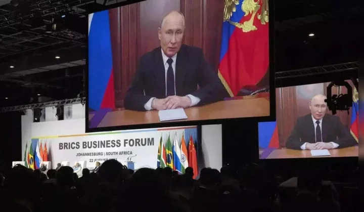 Wanted for war crimes, Putin avoids BRICS summit in South Africa, sends pre-recorded address.