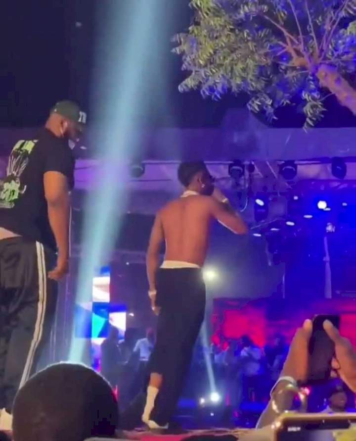 Bring him back - Wizkid says to bouncers dragging fan who tore his cloth in Abuja (Video)