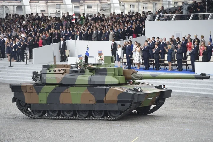 Donald Trump attends France's 2017 Bastille Day military parade, where he apparently got the idea to stage his own version back in 2018