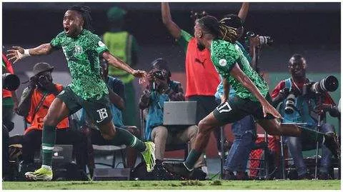 Alex Iwobi (right) and Ademola Lookman celebrate at the AFCON 2023.