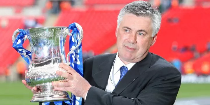 Carlo Ancelotti poses with the FA Cup in 2010.