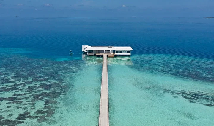 Inside the world's most expensive underwater hotel suite - where sharks swim past your bed