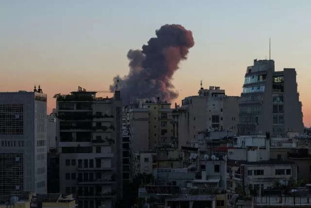  Smoke rises behind buildings in Beirut, Lebanon September 27, 2024.  (credit: REUTERS/EMILIE MADI)