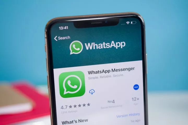 An image of an iPhone displaying WhatsApp on the App Store