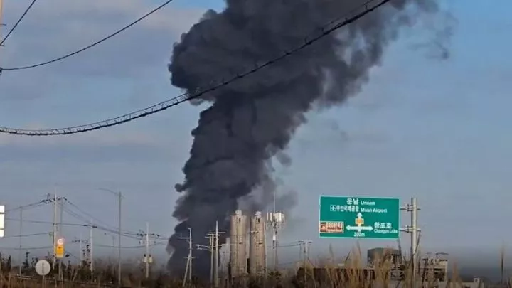 Thick smoke above the airport after the crash.<br />Pic: Reuters