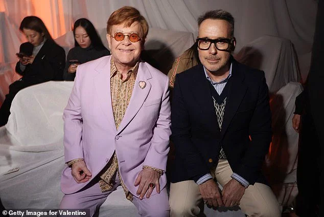 Sir Elton John (L) left husband David Furnish (R) emotional in his new documentary after saying he would 'not be around' to see their young sons get married (pictured in September)