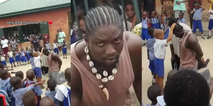 VeryDarkMan gets tongues wagging as he kneels while primary school students pray for him