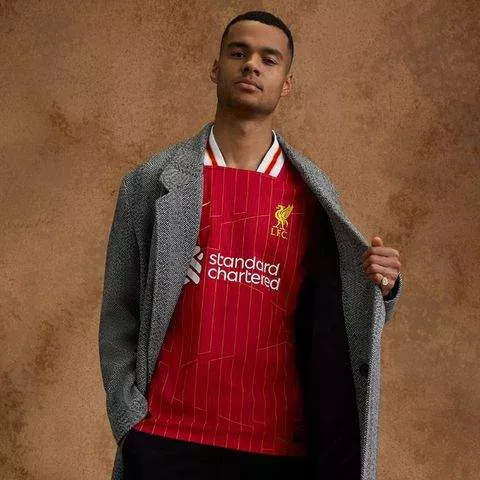 Check out the new Liverpool 2024/25 season jersey modeled by Salah, Van Dijk, and other first-team players.