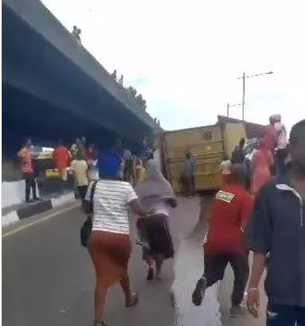 JUST IN: Panic In Lagos As Truck Falls From Overhead Bridge (VIDEO)