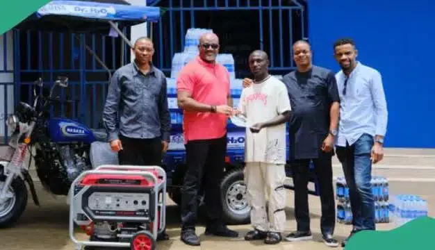 Aquafina empowers viral hawker, Dr. H20, rewards him with full business setup worth millions of naira