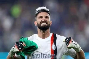 Olivier Giroud celebrates at the end of their game against Genoa on October 7