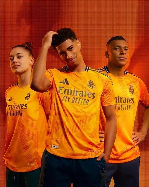 Inspired by Cristiano Ronaldo's La Decima triumph, check out the new 2024/25 Orange Real Madrid jersey modelled by Mbappe and Bellingham