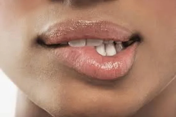 Image of a person biting their lip