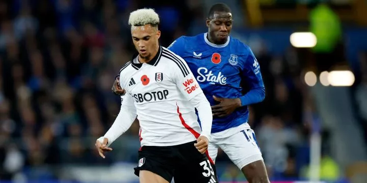 Fulham's Antonee Robinson in action with Everton's Abdoulaye Doucoure