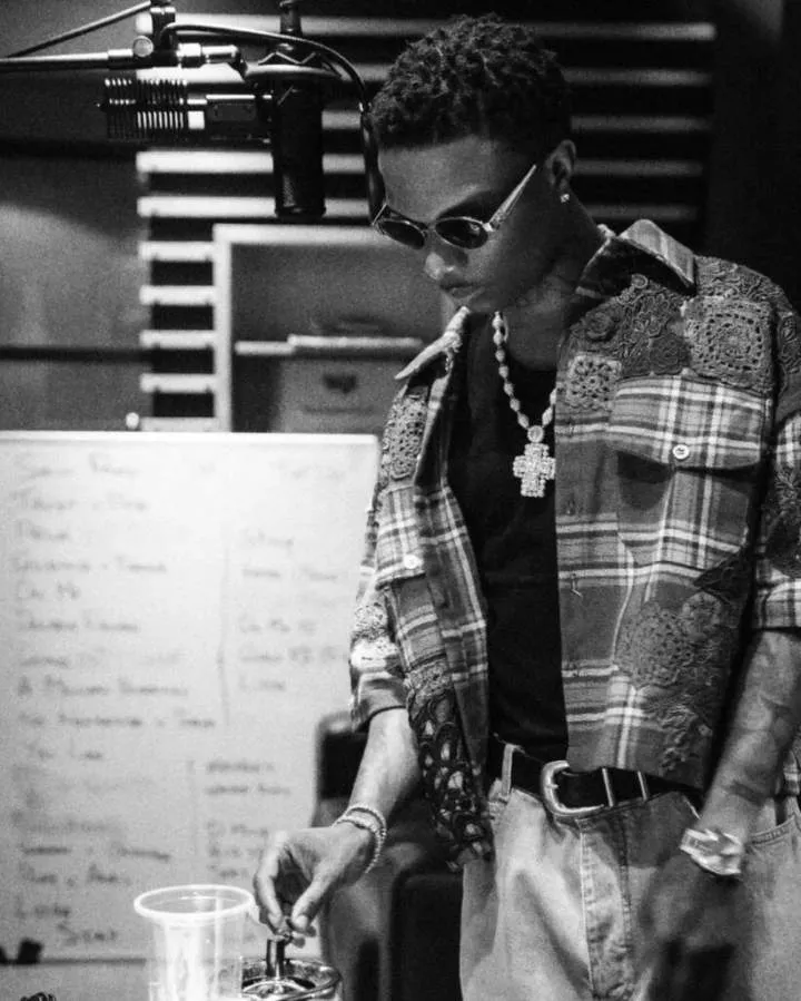 Wizkid teases fans with track list on whiteboard, fans anticipate new song