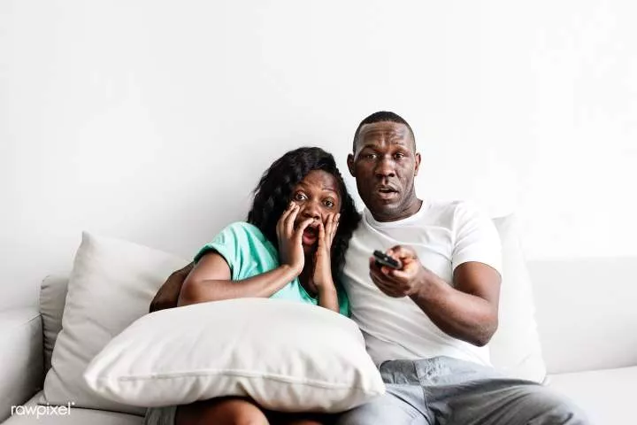 Download premium image of Black couple watching movie together at home about scared, scared black, black couple watching movi... - Black couples, Black person, Movies