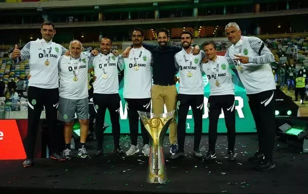 AVEIRO, PORTUGAL - JULY 31: Ruben Amorim of Sporting CP with staff celebrate winning the Portuguese SuperCup with trophy at the end of the Portuguese SuperCup match between Sporting CP and SC Braga at Estadio Municipal de Aveiro on July 31, 2021 in Aveiro, Portugal. (Photo by Gualter Fatia/Getty Images)