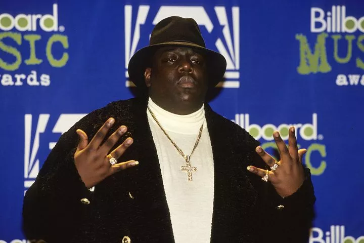 American rapper Notorious BIG shows off his diamond rings at the 1995 Billboard Music Awards