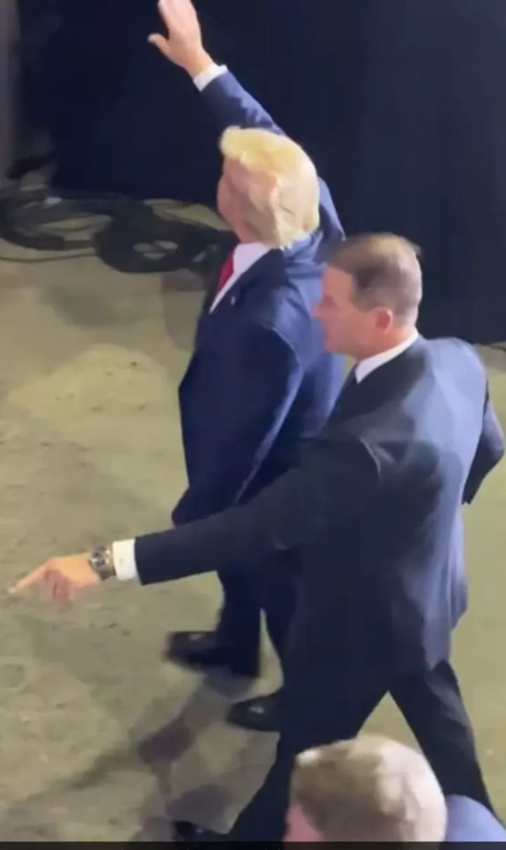 Moment Secret Service race to protect Trump after phone is thrown at him during rally (video)