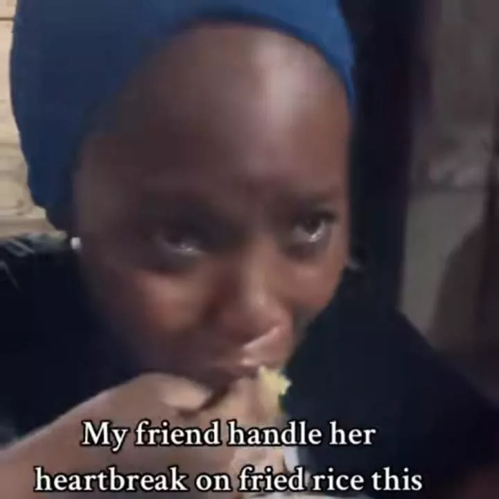 Nigerian lady feeds herself rice while crying as boyfriend ends 3-year relationship