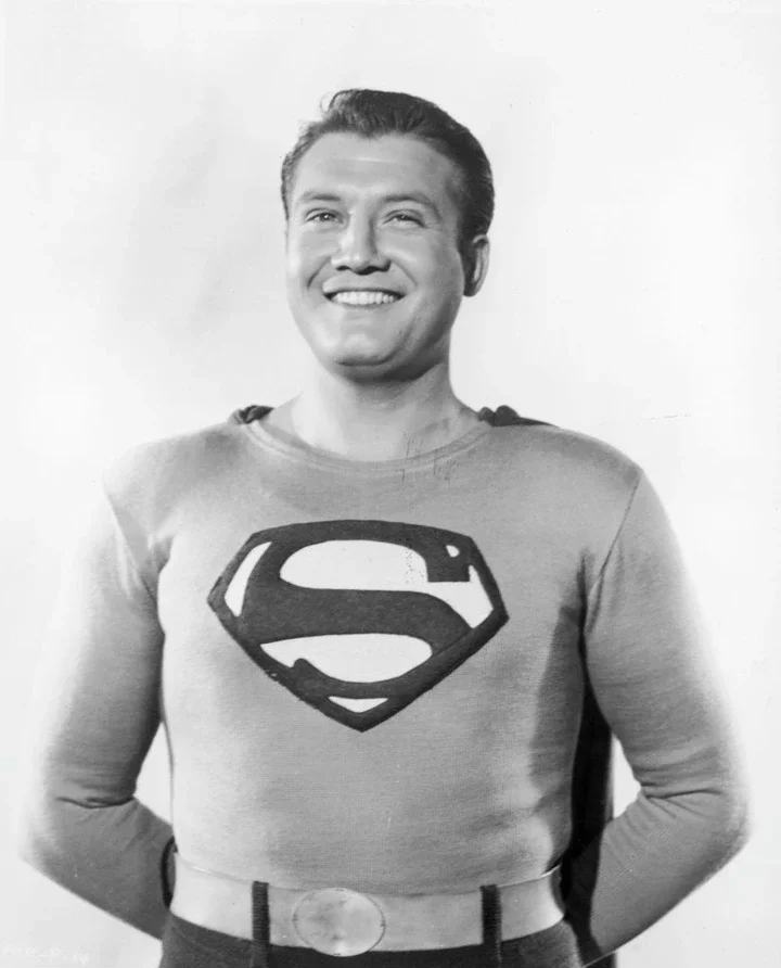 Smiling George Reeves in a Superman costume from a vintage photo