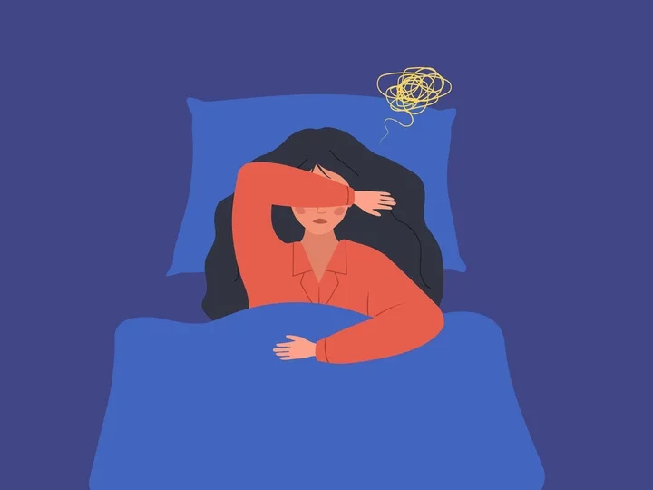 illustration of woman in bed struggling to sleep