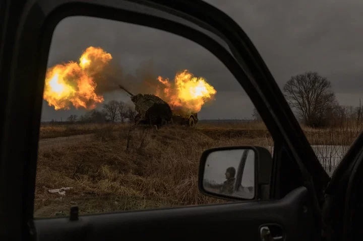 Ukrainian members of the 45th Artillery Brigade fire towards Russian positions in the Donetsk region