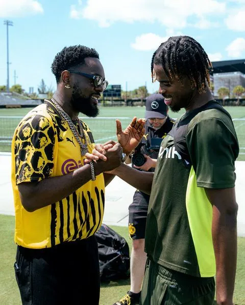 Nigerian Afrobeats star Patoranking teams up with Karim Adeyemi and Borussia Dortmund teammates at 2025 FIFA Club World Cup.