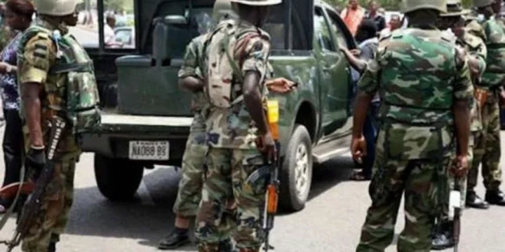 An image of military men during stop and search operation