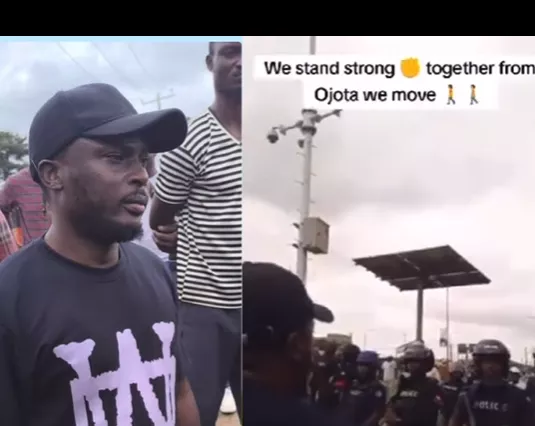 Bold man asks armed police officers in Ojota to stand with the people in the fight against Economic hardship and hunger (video)