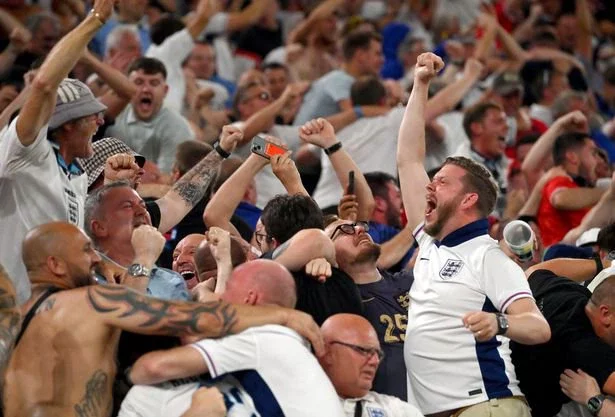 Fans of England celebrate after Ollie Watkins' winner