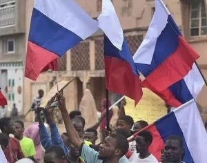 Demonstrators wave Russian flag