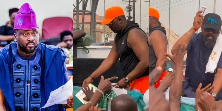 "People dey hungry una dey share perfume" - Netizens rage as Desmond Elliot shares perfume on the streets of Lagos