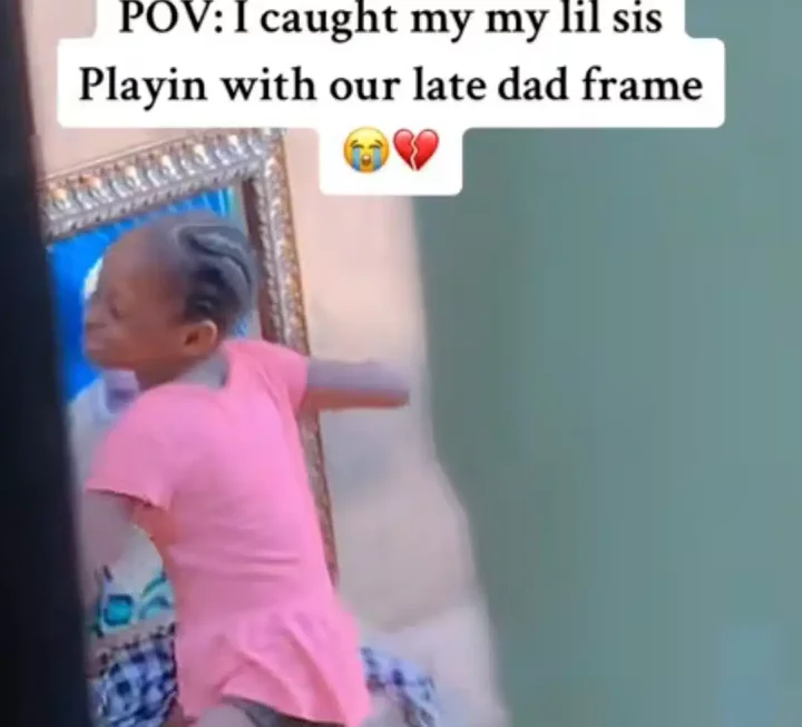 'I don't even know my dad' - Emotional scene unfolds as little girl kisses and hugs deceased father's framed photo