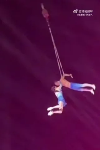 Chinese acrobat falls to her death after display goes wrong as her husband loses grip on her during performance