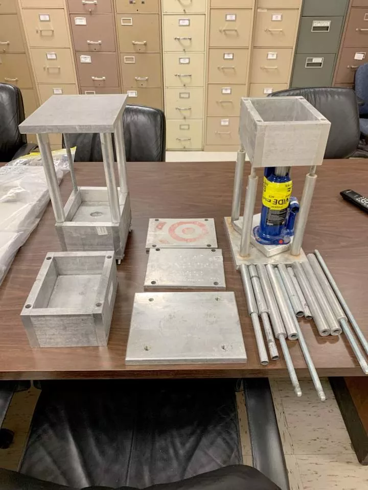 Authorities photographed drug paraphernalia including metal pipes and hollow boxes