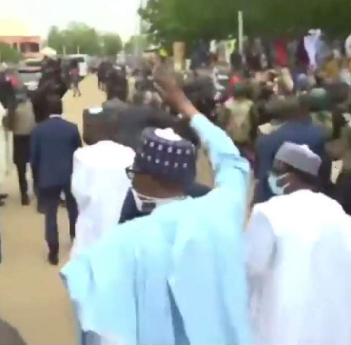 Daura residents file out to greet President Buhari as he treks to his home after observing his Sallah prayers at the Eid ground (video)