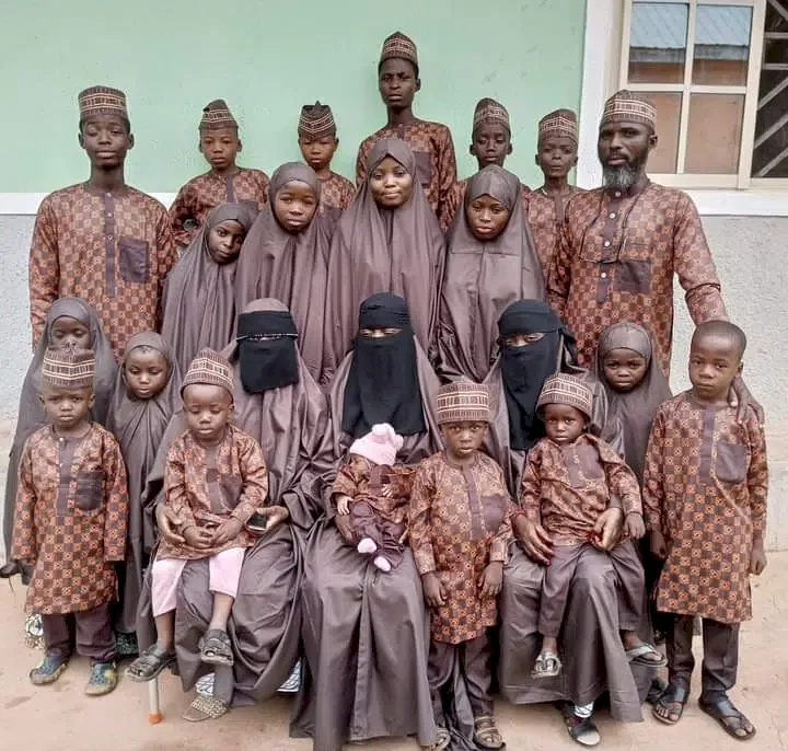 'Cash out for the tailor' - Man causes a stir as he strikes a pose with his 3 wives and 19 children (Photos)