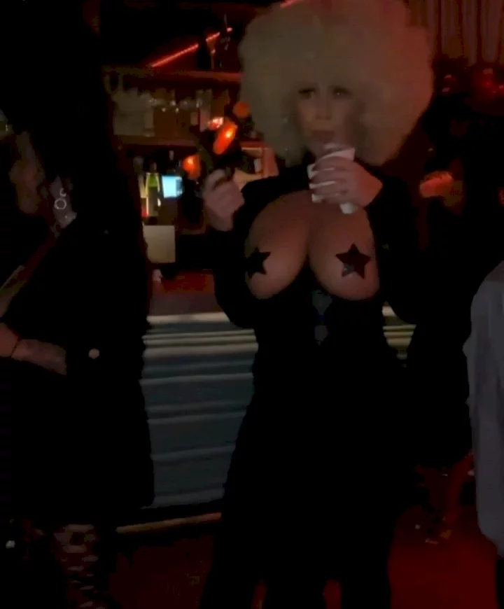 Amber Rose's b**bs hang out of her interesting Halloween costume